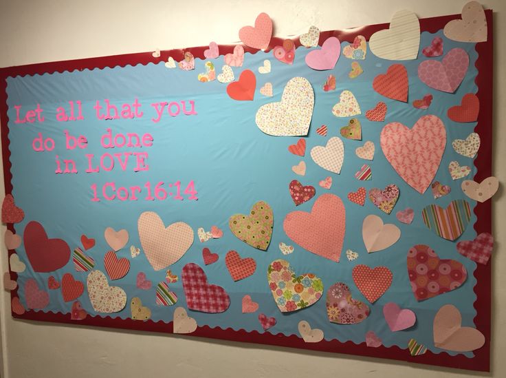 a bulletin board with hearts on it that says, let all that you do be done in love