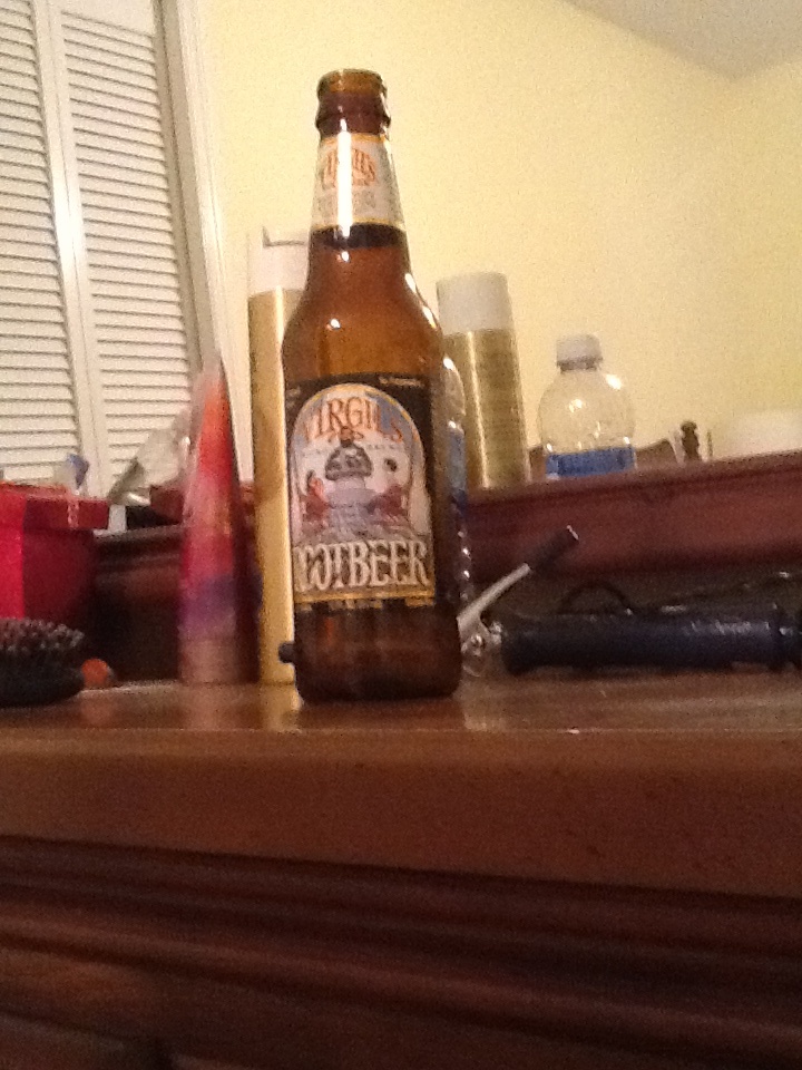 a beer bottle sitting on top of a wooden table