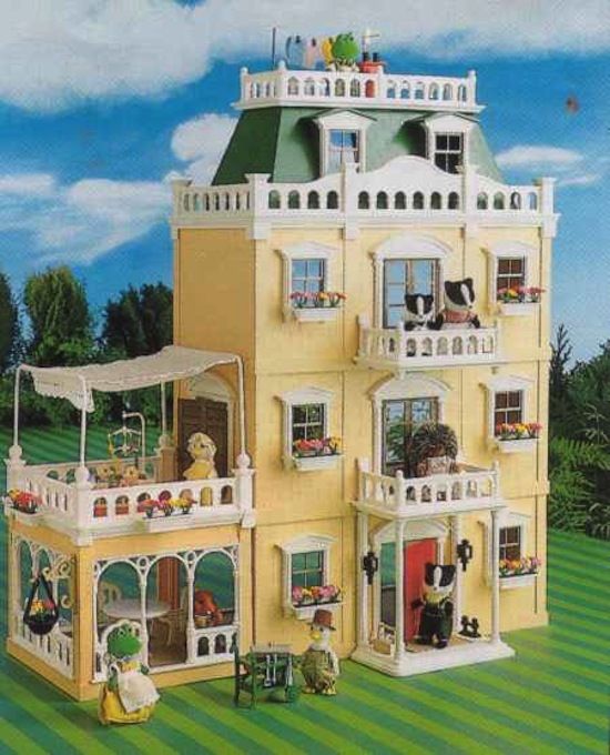 a large doll house with lots of windows and balconies