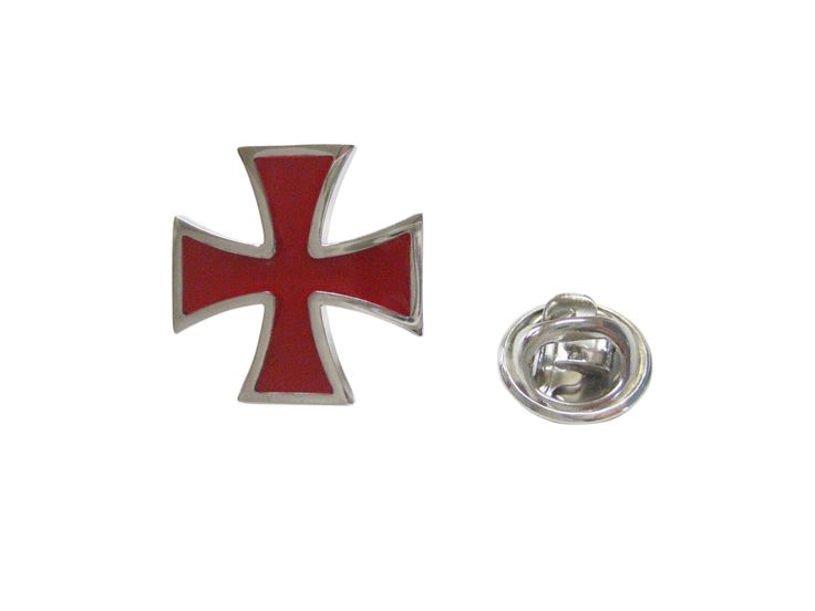 a red and silver pin with a cross on the front, sitting next to a white background