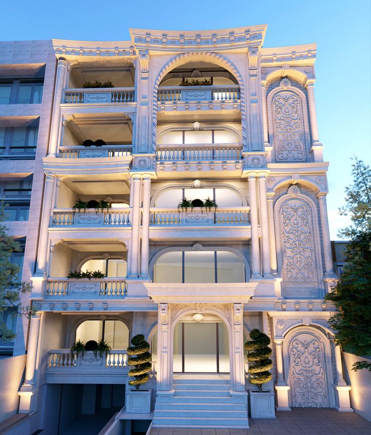 a large white building with many balconies on it's sides and stairs leading up to the second floor