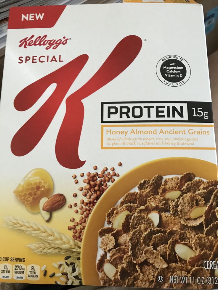 a box of cereal sitting on top of a shelf next to some other food items