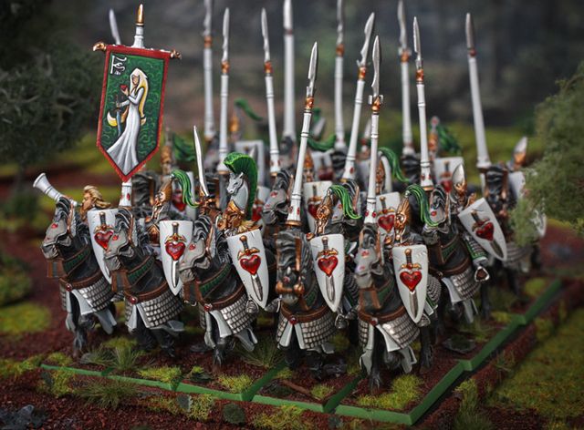 a group of knights with spears and shields on their heads are lined up in formation