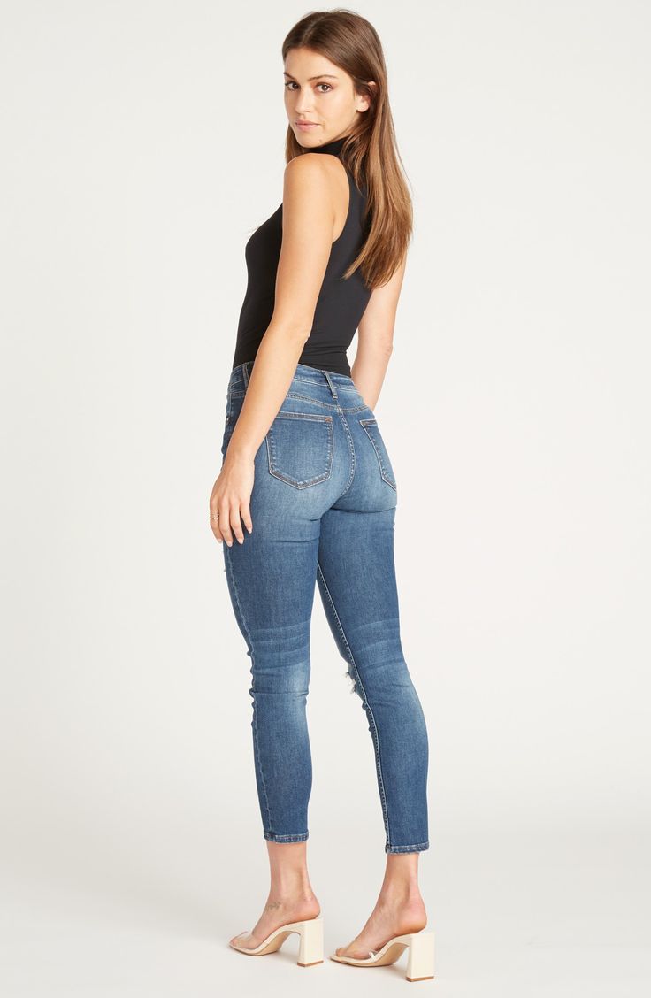 Threadbare distressing and a heavily faded wash add grungy swagger to curve-hugging skinny jeans finished with raw, cutoff hems. 26" inseam; 10 1/2" leg opening; 9" front rise; 13" back rise (size 29). Zip fly with button closure. Five-pocket style. 98% cotton, 2% spandex. Machine wash cold, tumble dry low. By Vigoss; imported. BP. Distressed High Rise Jeans In Medium Wash, High Rise Distressed Medium Wash Jeans, High Rise Medium Wash Distressed Jeans, High-rise Faded Jeans With Frayed Hem, High Rise Faded Jeans With Frayed Hem, Edgy Ripped Fitted Jeans, Stretch Distressed Faded Bottoms, Mid-rise Distressed Medium Wash Jeans, Distressed Fitted Medium Wash Jeans