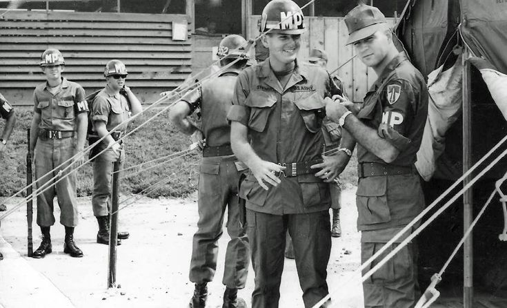 black and white photograph of men in uniform