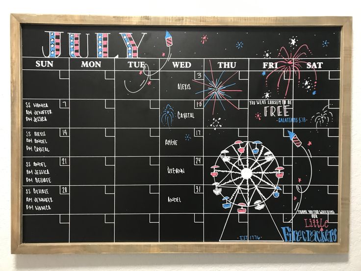 a chalk board with writing on it that says july and the fireworks are lit up