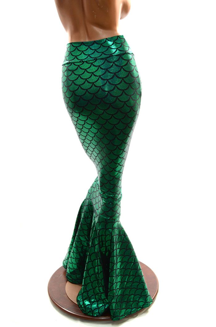 a green mermaid tailed skirt on top of a mannequin