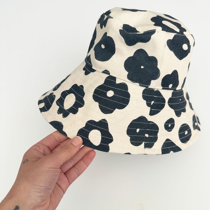 Perfect for a day of fun in the sun, our bucket hat is structured with an extra-wide brim to keep you cool and covered on the go. 100% cotton canvas screen printed with water-based inks Made in California Brim: 3.5" Circumference: 23" To clean: spot clean and/or dry clean. Trendy Cotton Sun Hat For Vacation, Adjustable Cotton Summer Hat, Fun Cotton Summer Bucket Hat, Fun Summer Cotton Bucket Hat, Fun Summer Bucket Hat With Curved Brim, Trendy Brimmed Cotton Sun Hat, Adjustable Cotton Sun Hat For Summer, Adjustable Cotton Summer Sun Hat, White Cotton Bucket Hat For Summer