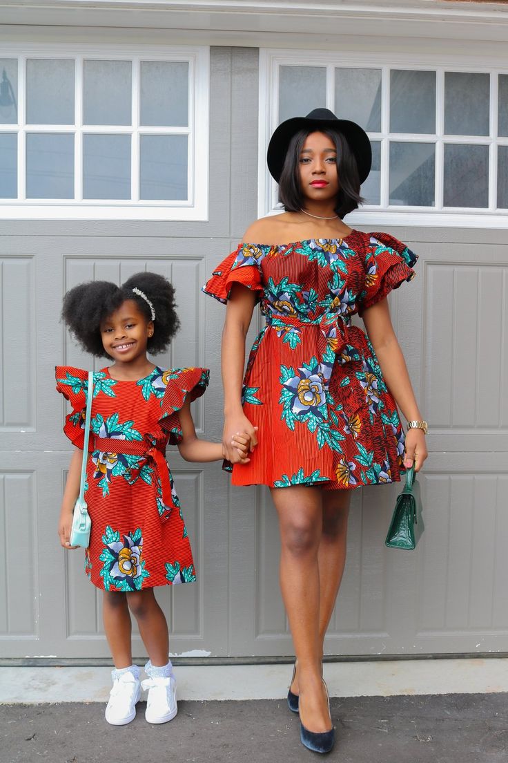 Loose flare dress. Detachable belt for a fit and flare look. Dress is lined. Pockets. Flare off shoulder sleeves. Available as mommy & me. Model is wearing a size S and is 5' 8 tall. Dress length approx. 38inches(S-XL)and 40 inches for (2X/3X) Ankara For Kids Girls Dresses, Ankara Dress Styles For Kids, Mom Daughter Outfits, Mommy Daughter Outfits, Daughter Outfits, Mother Daughter Fashion, African Dresses For Kids, Stylish Mom, Ladies Gown