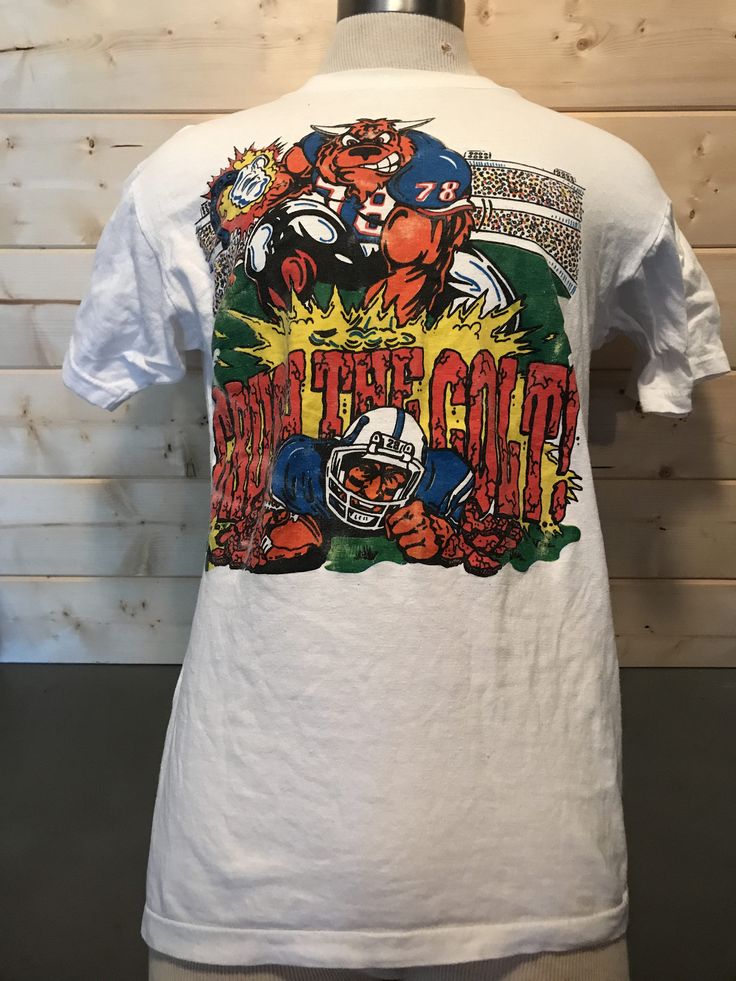 Vintage 1980's Buffalo Bills Destroy the Colt  Cartoon T-Shirt Awesome  NFL by 413productions on Etsy Cartoon T Shirt, Vintage T Shirts, Cartoon T Shirts, Buffalo Bills, Vintage Tshirts, Buffalo, Nfl, Mens Graphic Tshirt, T Shirts