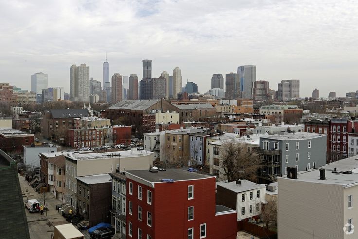 the city is full of tall buildings and skyscrapers in this view from an apartment building