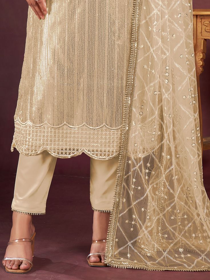 Introducing a charming beige net kameez adorned with delicate threadwork, sequin detailing, and fancy readymade lace border, creating an ensemble that exudes elegance. Paired seamlessly with a crepe salwar in a matching beige shade, this outfit is a perfect blend of sophistication and style.
Completing the ensemble is a net dupatta in a similar beige color, featuring sequin work, thread embroidery, and a fancy lace border.
The beige salwar kameez comes as an un-stitched material, accommodating s Fitted Cream Palazzo Set With Dupatta, Festive Cream Palazzo Set With Dupatta, Elegant Beige Palazzo Set For Diwali, Cream Bollywood Palazzo Set With Resham Embroidery, Festive Cream Georgette Palazzo Set, Bollywood Style Cream Palazzo Set With Resham Embroidery, Traditional Fitted Beige Palazzo Set, Festive Cream Semi-stitched Palazzo Set, Fitted Beige Traditional Palazzo Set