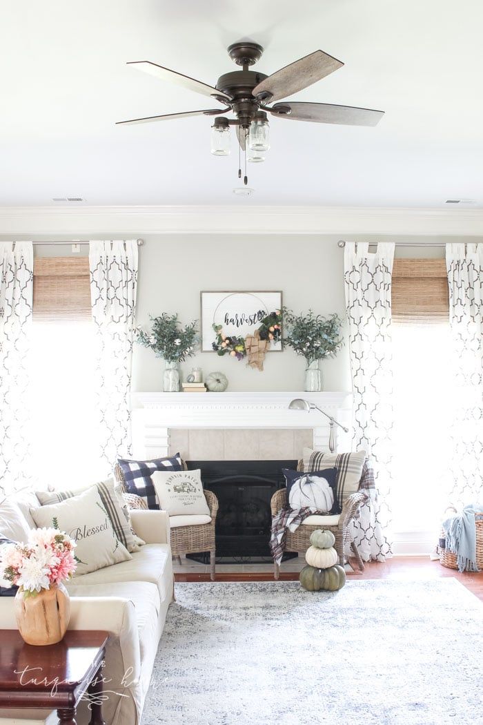 the living room is clean and ready to be used for christmas time, as well as decorations