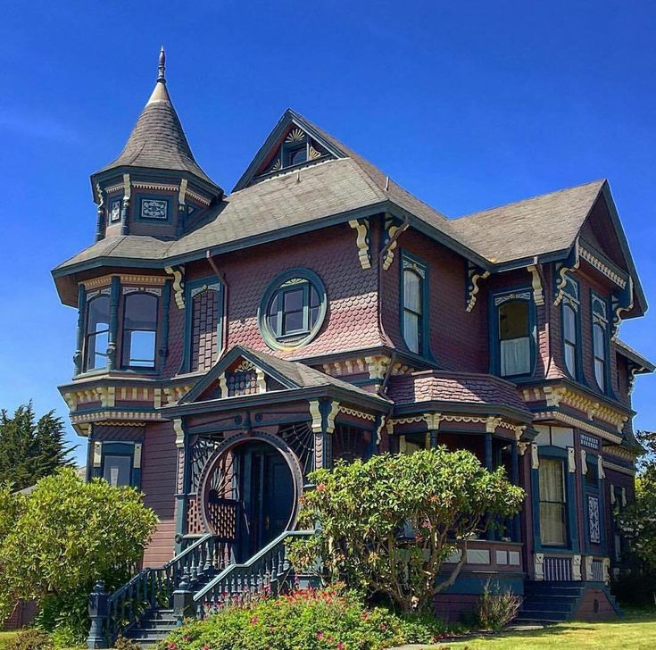 an old victorian style house with many windows