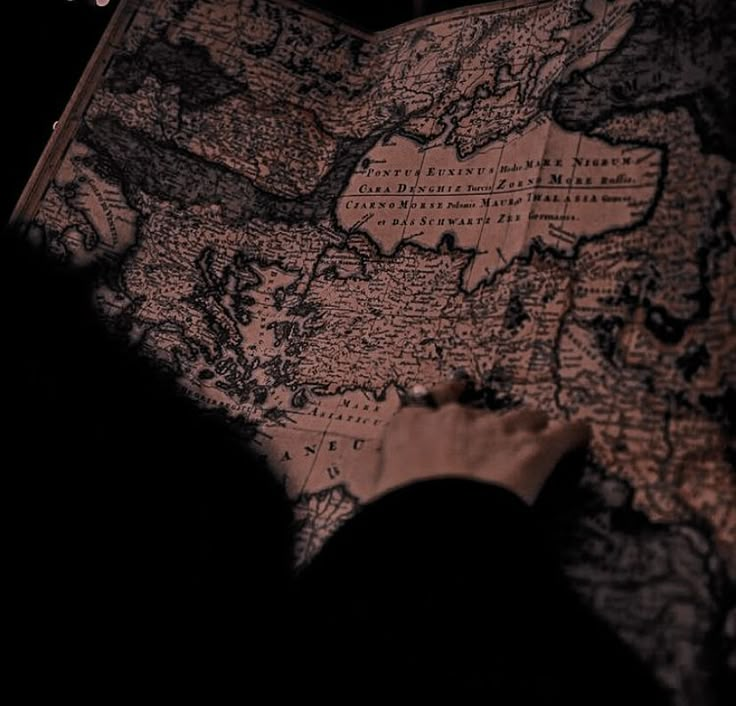 a person looking at a map in the dark