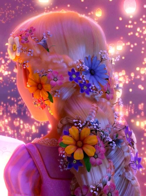 a woman with blonde hair and flowers in her hair is looking into the distance while wearing pink