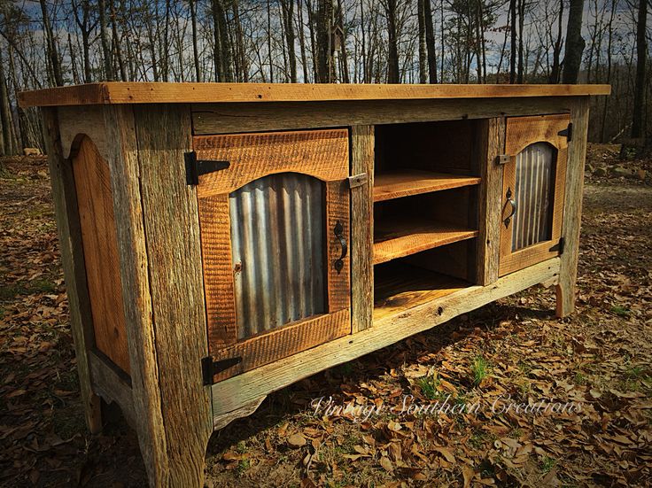 an old wooden cabinet sitting in the woods