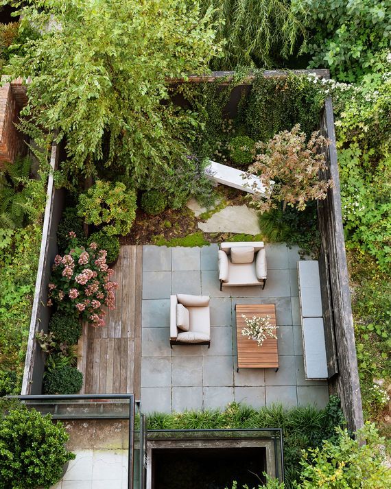 an overhead view of a patio with furniture and trees