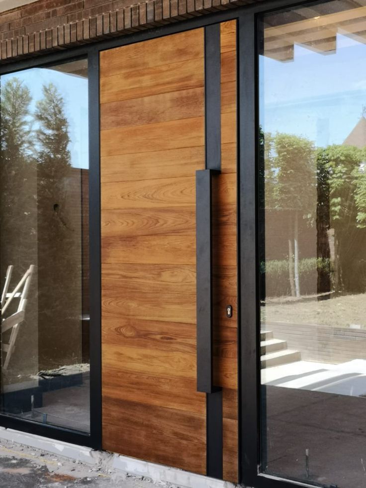 a wooden door with glass on the outside