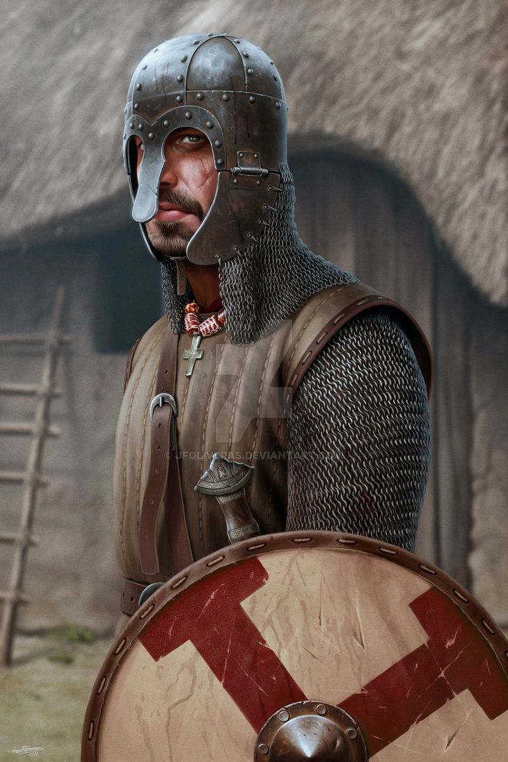 a man dressed in armor and holding a shield