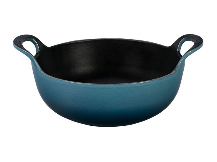 a black cast iron skillet on a white background