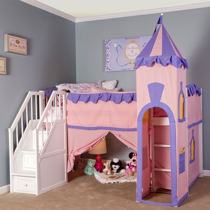 a child's bedroom with a pink castle bed and stairs