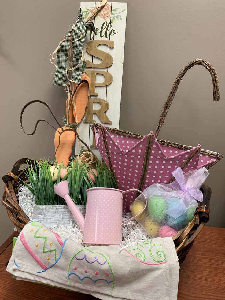 a basket filled with lots of stuff sitting on top of a table next to a sign