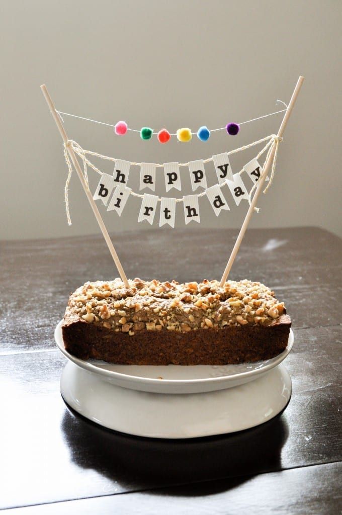 a cake on a plate with a happy birthday banner