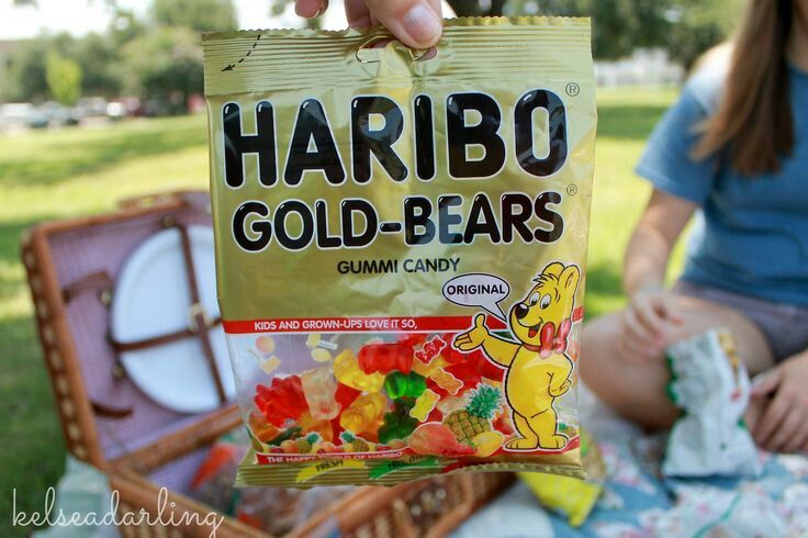 a bag of harbo gold - bears sitting on top of a picnic table