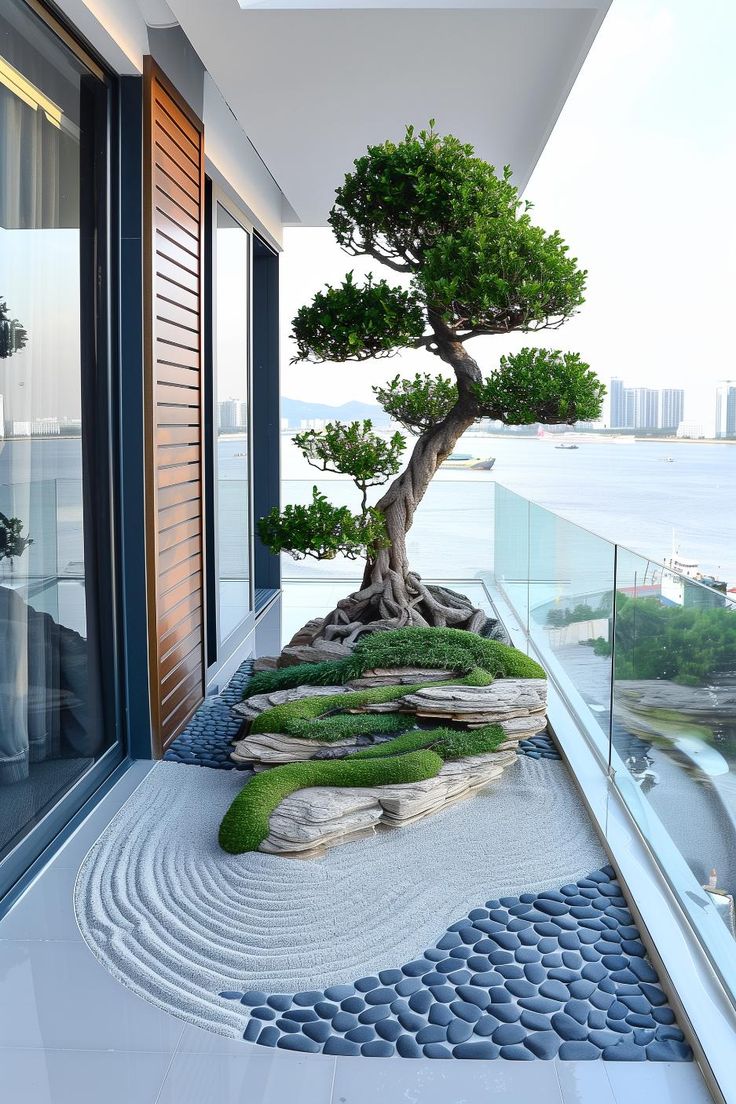 a bonsai tree is growing in the middle of a room with glass walls and floor to ceiling windows