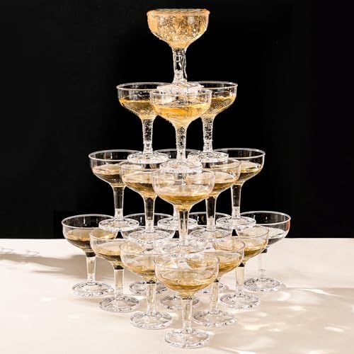 there are many wine glasses stacked on top of each other in the shape of a pyramid