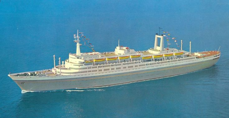 a large white ship floating on top of the ocean