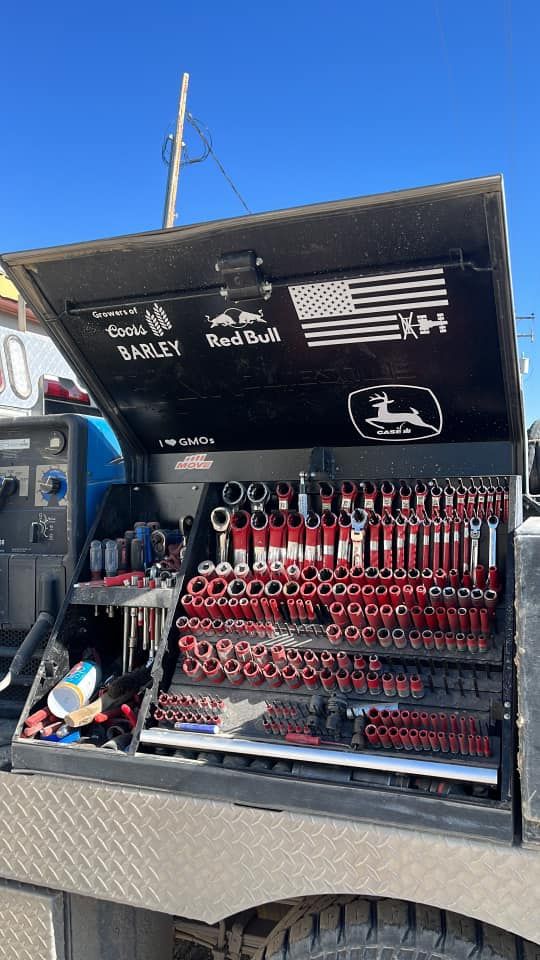 the back end of a truck with tools in it