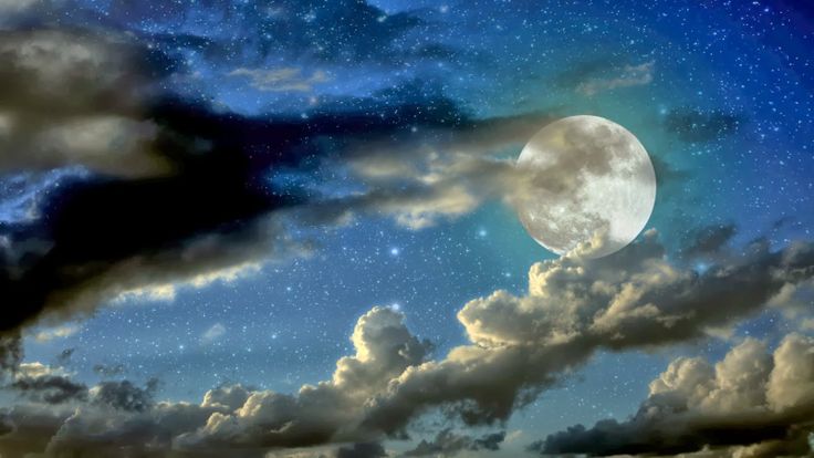 the night sky with clouds and a full moon