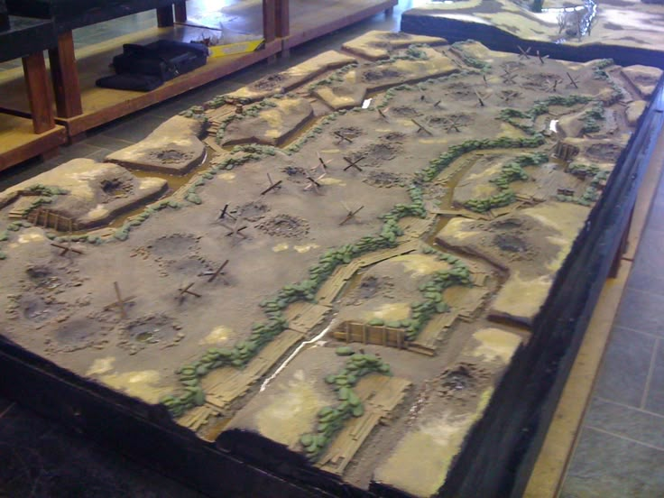 a large model train set on display in a room with wooden shelves and other items