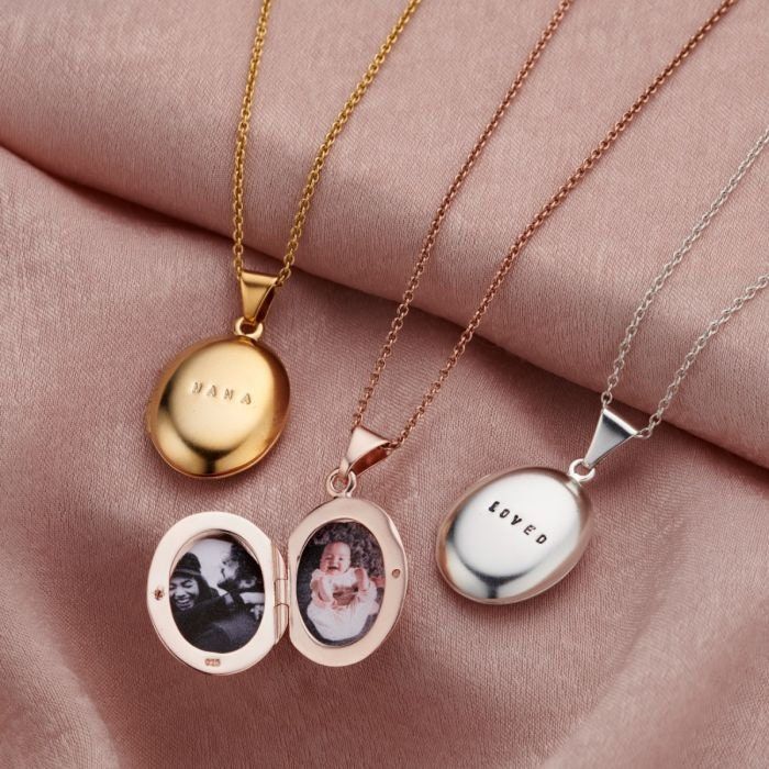 This classic style locket necklace is made from beautiful 925 Sterling Silver. Suspended from a dainty silver trace chain, the locket is double-sided inside so you can enclose up to two photos, one on each side. Our jewellers can also personalise your locket with a short name or date, making your locket truly unique. For an extra special touch, our jewellers can also plate your necklace in either 18ct Yellow Gold or 18ct Rose Gold. Choose from black and clear letter finish. We can print your cho Elegant Locket Jewelry Gift, Personalized Silver Locket Necklace For Mom, Mother's Day Sterling Silver Locket Necklace Gift For Mom, Mother's Day White Gold Locket Necklace, Classic Locket Necklace For Valentine's Day Gift, Elegant Locket Jewelry As Gift For Mom, Silver Pendant Locket Necklace Gift For Mom, Elegant Locket Necklace For Mother's Day, Sterling Silver Round Locket Necklace For Mother's Day