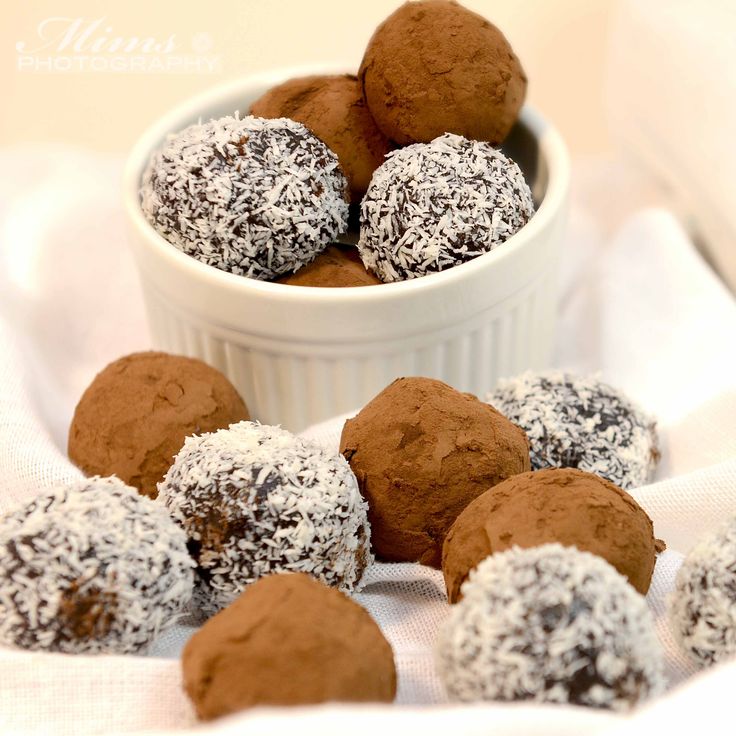 chocolate truffles are in a white bowl