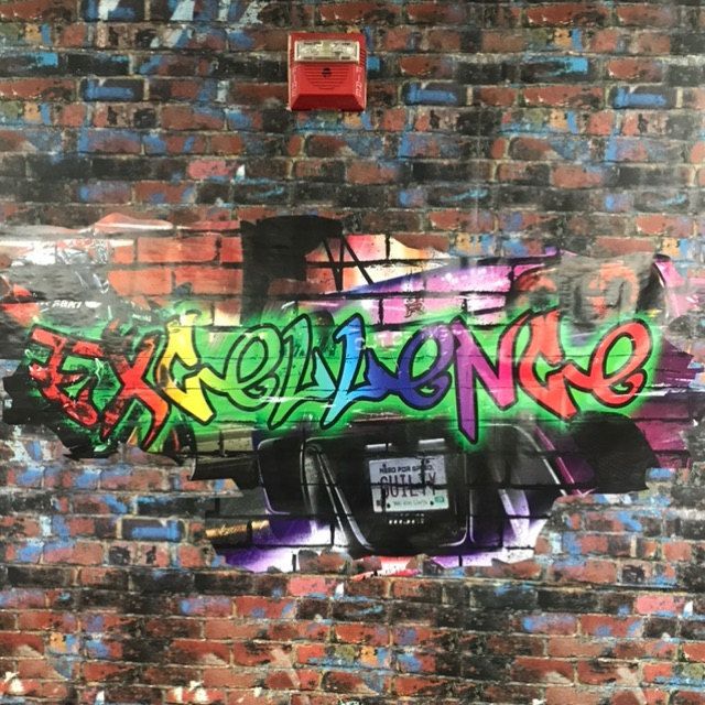 graffiti on the side of a brick wall