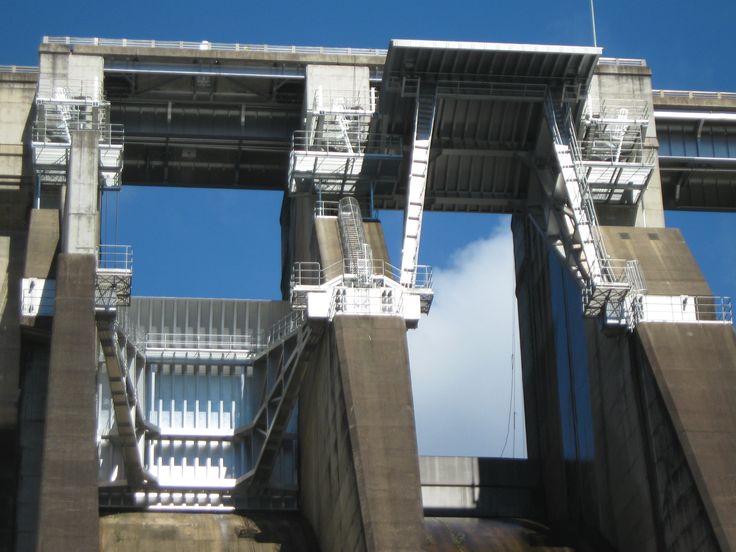 two large concrete structures with metal railings