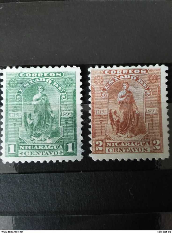 three different colored stamps on display in a case, one with an image of the virgin mary