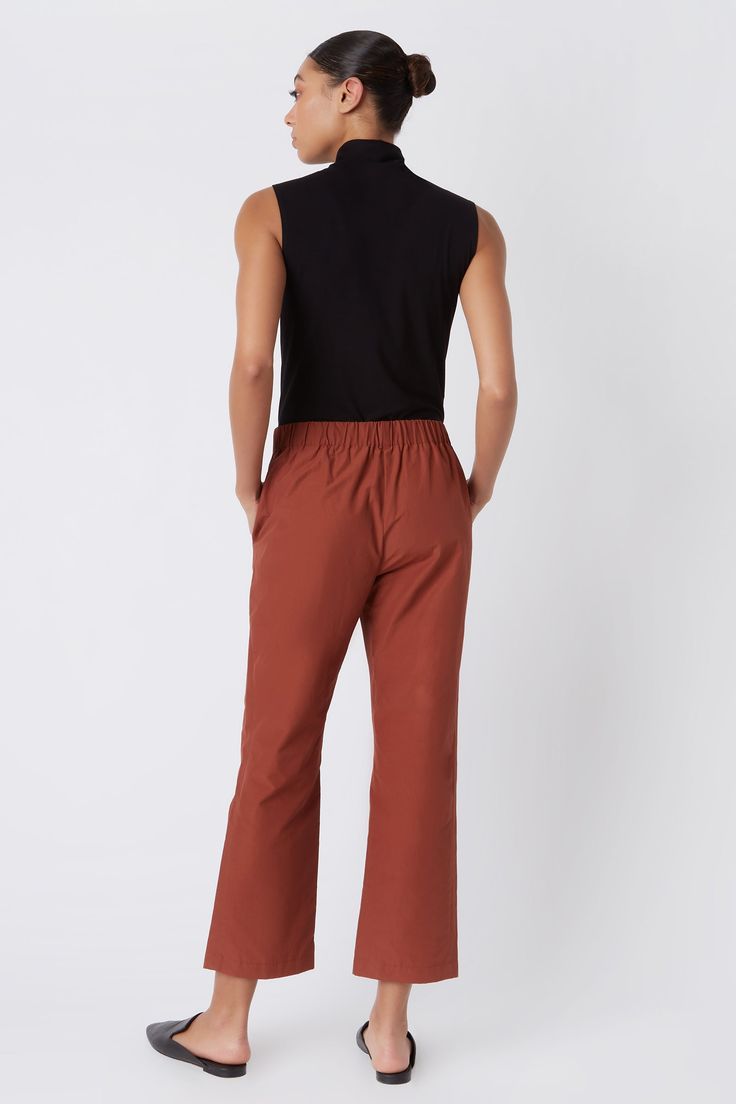 Fall calls for ease with our elastic waist Brit Crop Pant. With a mid-rise fit, angle seam pockets and the perfect leg opening, this style is a breeze to wear in the cooler weather. Pair it with your favorite ankle boot or sneaker, this style is designed for women on the go.THIS ITEM IS FINAL SALE. 1.5" front waistband, elastic at sides and back, angle seams with front pockets, midrise, easy fit, clean finish hem. - 51% Cotton, 49% Nylon - Fabric Woven in Italy - Made in NYC - Professional dry c Fall Pants With Elastic Waistband And 5-inch Inseam, Fall Ankle-length Pants With Seam Detailing, Relaxed Fit Ankle-length Pants With Button Closure, Relaxed Fit Orange Ankle-length Pants, Stretch Ankle-length Pants With Seam Detailing, Perfect Legs, Cooler Weather, Cropped Pants, Mid Rise