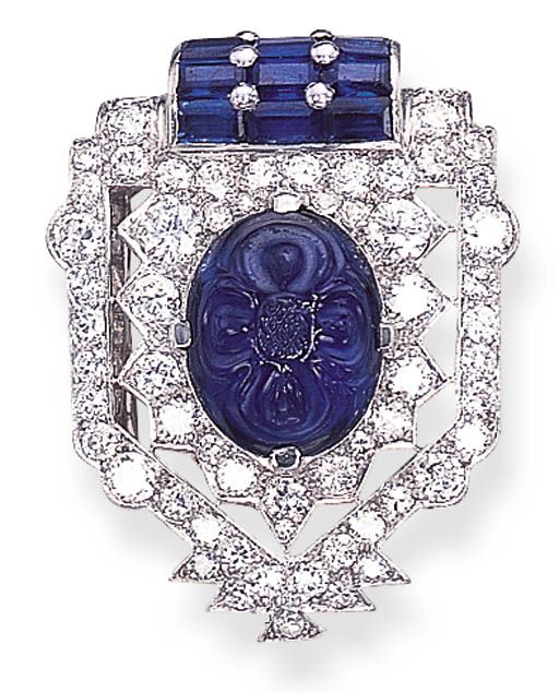 AN ART DECO SAPPHIRE AND DIAMOND CLIP, BY CARTIER   Designed as a circular-cut diamond openwork stylised shield-shaped panel set with a central carved sapphire, to the calibré-cut sapphire detail, circa 1925  Signed Cartier Bijoux Art Deco, Vintage Fine Jewelry, Cartier Jewelry, Sterling Silver Brooch, Art Nouveau Jewelry, Ruby Jewelry, Deco Jewelry, Silver Brooch, Art Deco Jewelry