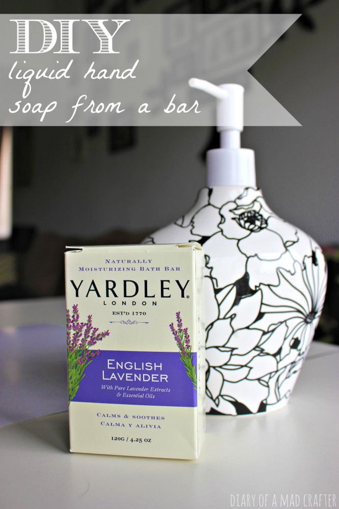 a soap dispenser with lavender on it next to a bar of soap