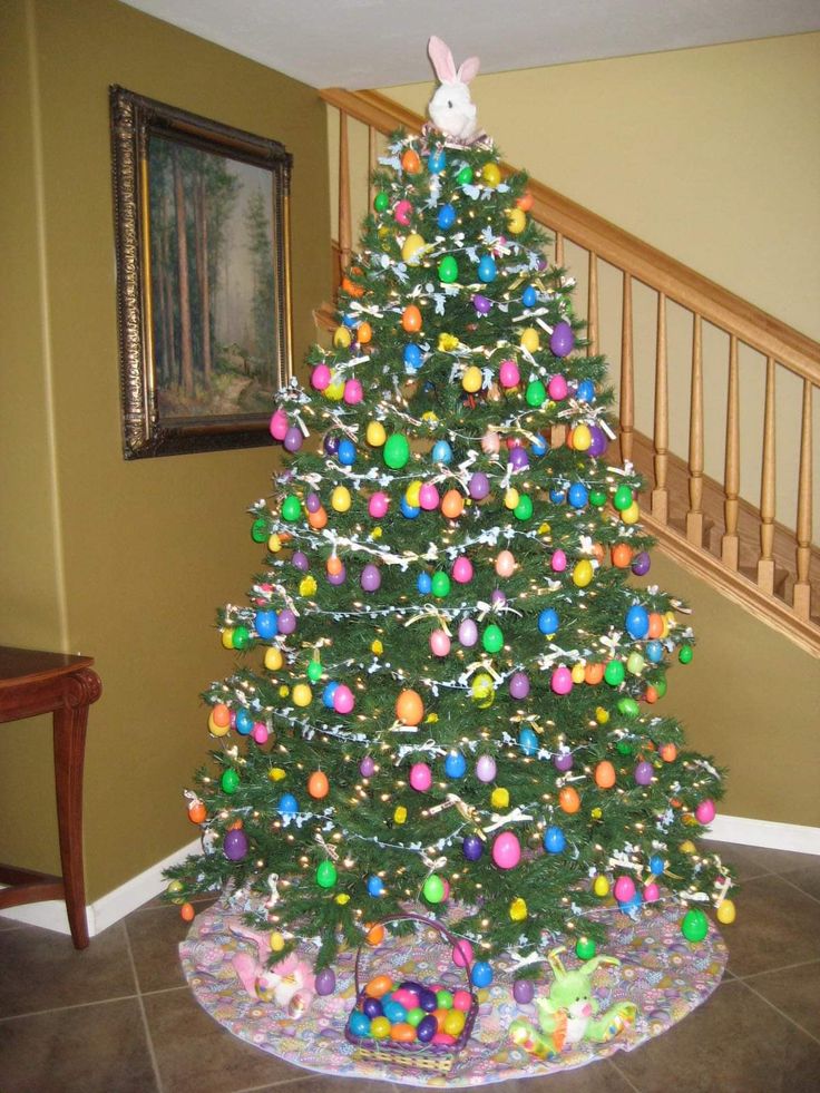 a decorated christmas tree in the corner of a room