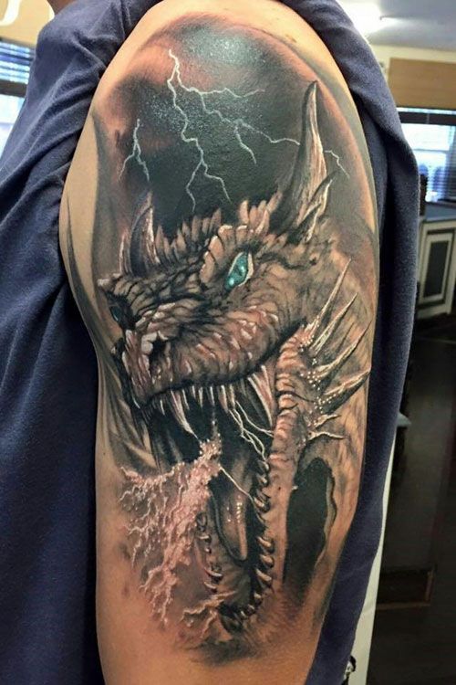 a man with a dragon tattoo on his arm