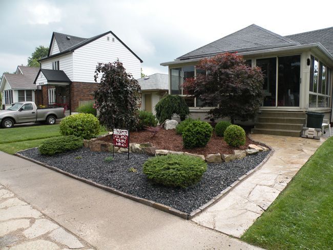 the front yard of a house with landscaping