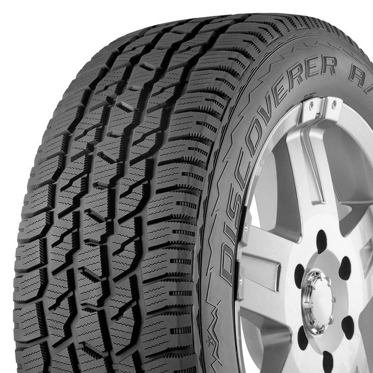 an all terrain tire on a white background