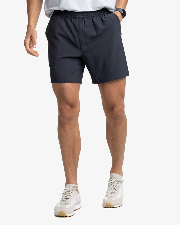 The front view of the Southern Tide Rip Channel 6 Inch Performance Short by Southern Tide - Caviar Black Casual Training Shorts With 5-inch Inseam, Casual Athletic Shorts With 5-inch Inseam For Sports, Outdoor Sportswear With Built-in Shorts, Functional Shorts With Drawstring For Outdoor Activities, Functional Drawstring Shorts For Outdoor Activities, Recycled Polyester Athletic Shorts With Built-in Shorts For Outdoor, Recycled Polyester Short Activewear For Outdoor, Outdoor Athletic Shorts With Built-in Shorts In Recycled Polyester, Relaxed Fit 5-inch Inseam Sports Activewear