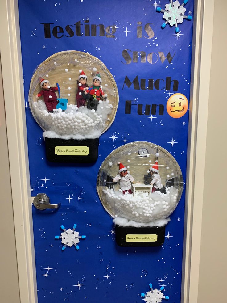 two snow globes sitting on top of a door