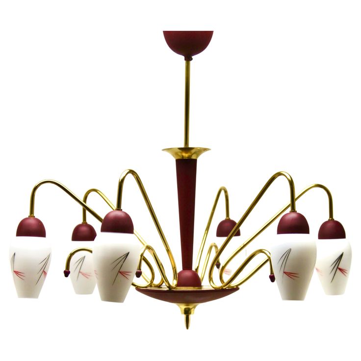 a chandelier with six lights hanging from it's sides and four arms